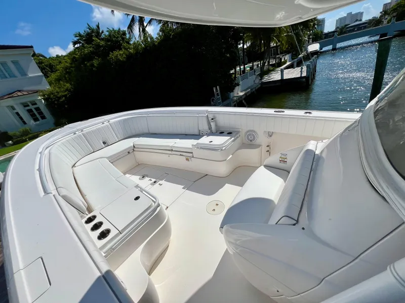 Slide: The Image of 2015 Intrepid 375 Center Console boat with spacious seating and cup holders. - 3