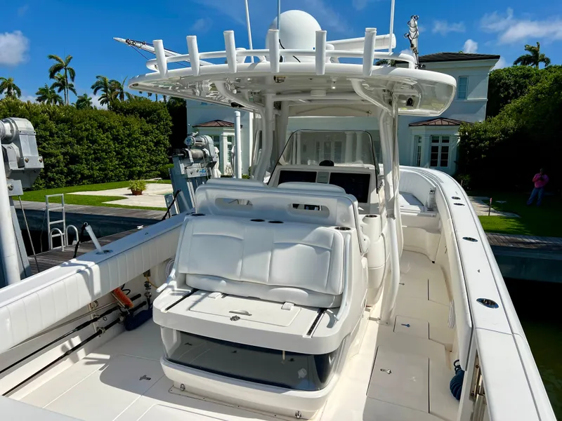 Slide: The Image of 2015 Intrepid 375 Center Console boat with spacious white seating area. - 7