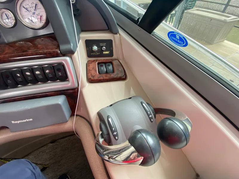 Slide: The Image of 2005 Four Winns 348 Vista boat controls and dashboard with throttle levers and gauges. - 14