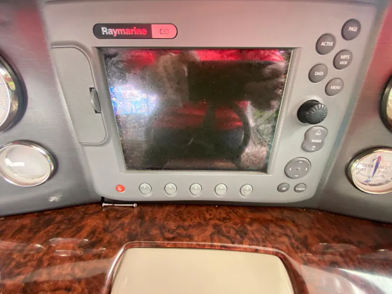 Slide: The Image of Raymarine navigation system on 2005 Four Winns 348 Vista boat dashboard. - 15