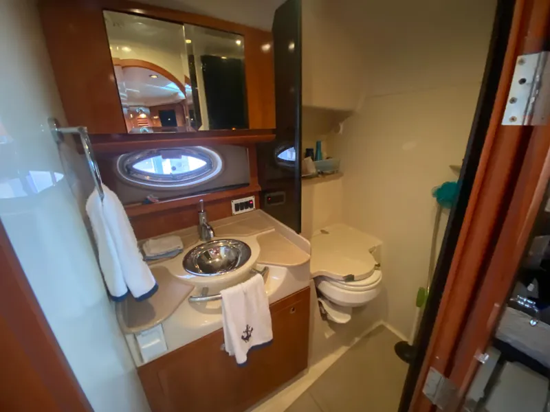 Slide: The Image of 2005 Four Winns 348 Vista yacht bathroom with sink, mirror, and toilet. - 23