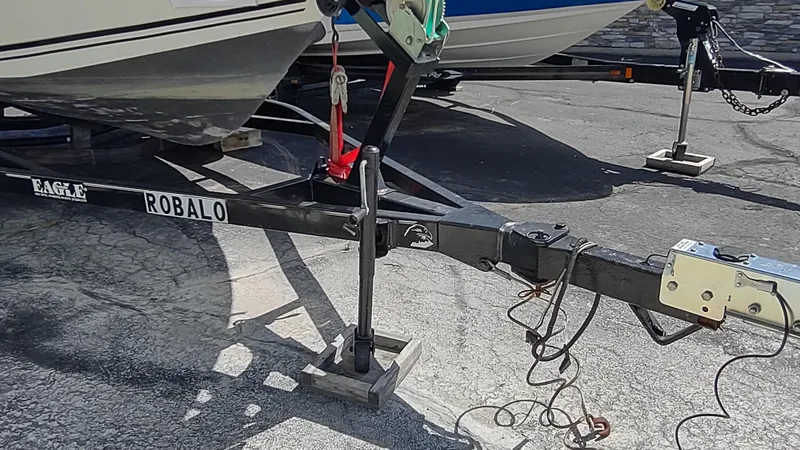 Slide: The Image of Trailer for 2001 Robalo 2020 Center Console boat parked on pavement. - 16