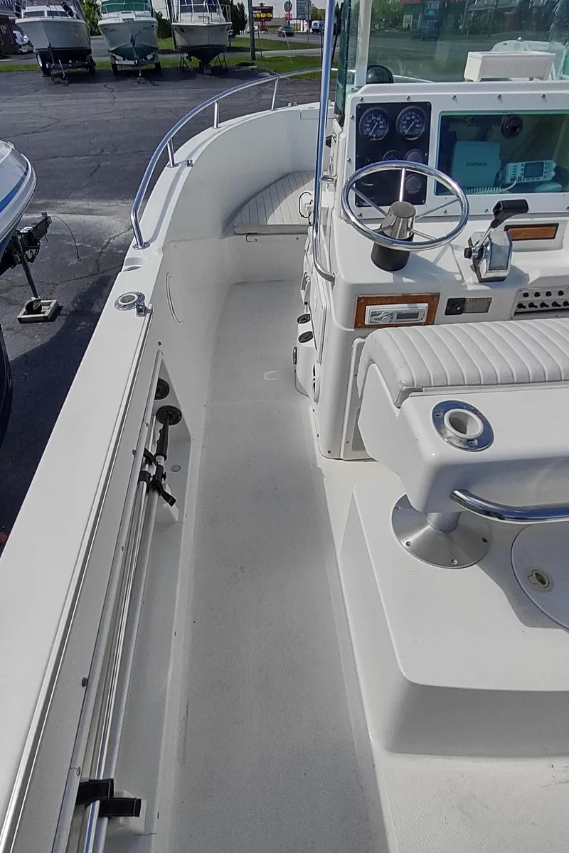 Slide: The Image of 2001 Robalo Center Console boat interior with steering wheel and seating. - 18