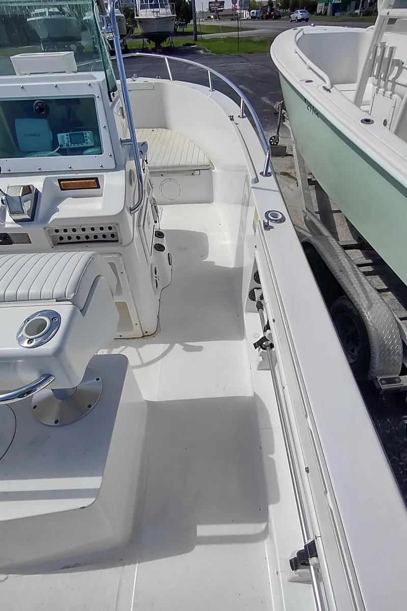 Slide: The Image of 2001 Robalo Center Console boat interior with seating and control panel. - 19
