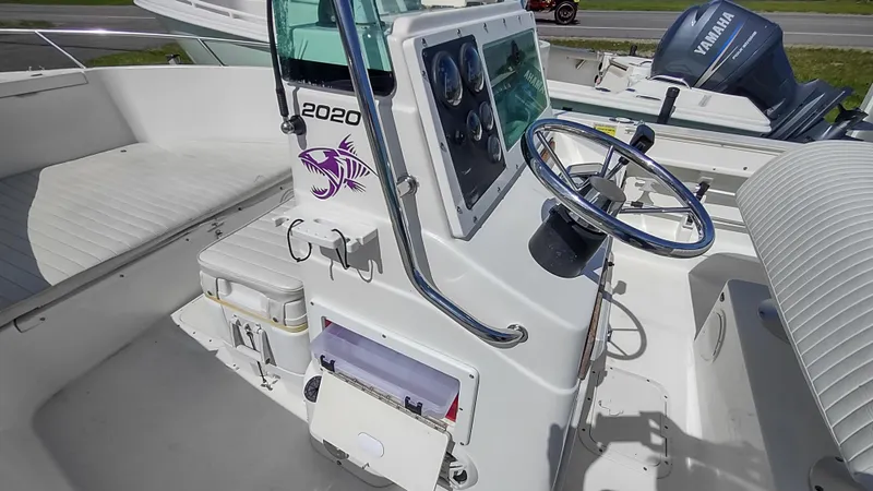 Slide: The Image of Robalo 2020 Center Console boat interior with steering wheel and Yamaha engine, 2001 model. - 5
