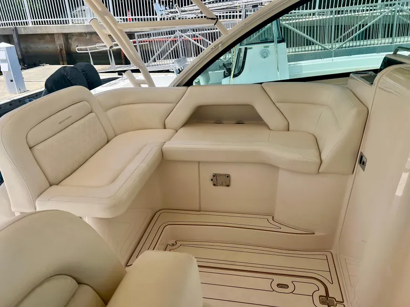 Slide: The Image of Luxurious seating area on 2021 Grady-White Freedom 375 boat, featuring elegant cream upholstery. - 13