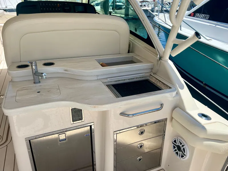 Slide: The Image of 2021 Grady-White Freedom 375 boat interior with kitchenette and storage drawers. - 16