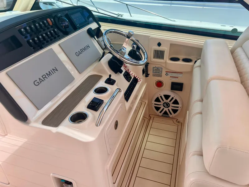 Slide: The Image of 2021 Grady-White Freedom 375 helm with Garmin displays and luxurious seating. - 19