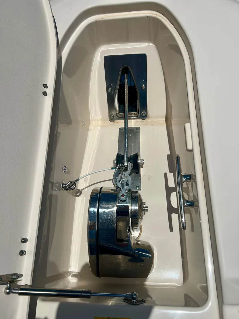 Slide: The Image of Anchor compartment of 2021 Grady-White Freedom 375 boat, featuring a stainless steel windlass. - 31