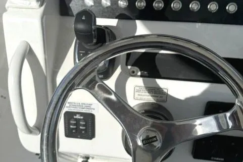 Slide: The Image of Steering wheel and controls of a 2021 Regulator 25 boat. - 8