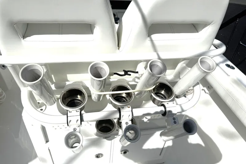 Slide: The Image of 2021 Regulator 25 boat rod holders and seating area in bright sunlight. - 9