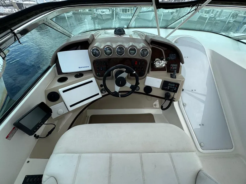 Slide: The Image of Helm of 2006 Carver 56 Voyager yacht with steering wheel and navigation instruments. - 18