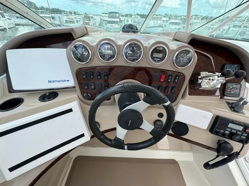 Slide: The Image of Helm of 2006 Carver 56 Voyager yacht with steering wheel and navigation instruments. - 19