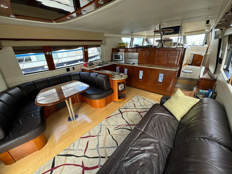 Slide: The Image of Luxurious interior of 2006 Carver 56 Voyager yacht with leather seating and modern kitchen. - 23