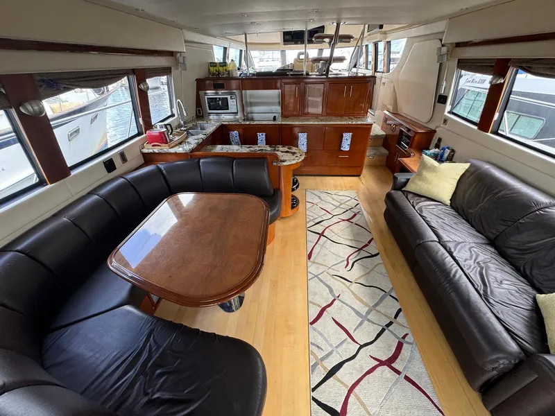 Slide: The Image of Luxurious interior of 2006 Carver 56 Voyager yacht with leather seating and modern kitchen. - 24
