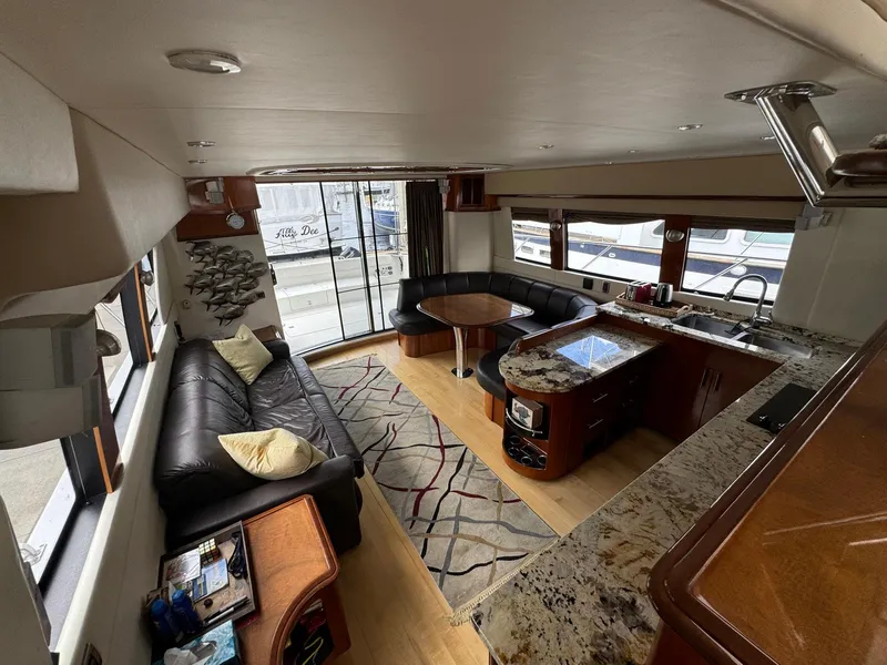 Slide: The Image of Luxurious interior of a 2006 Carver 56 Voyager yacht with modern furnishings and spacious layout. - 27