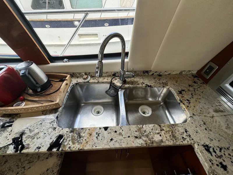 Slide: The Image of Granite countertop with double sink in 2006 Carver 56 Voyager yacht kitchen. - 32