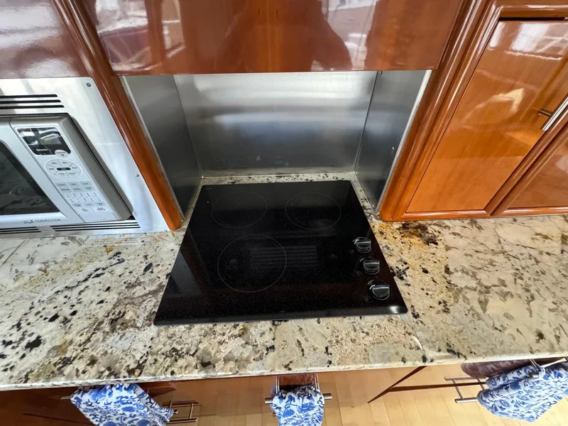 Slide: The Image of Modern kitchen in 2006 Carver 56 Voyager yacht with granite countertop and electric cooktop. - 34