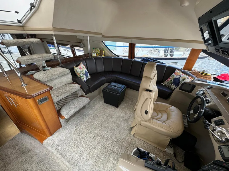 Slide: The Image of Luxurious interior of a 2006 Carver 56 Voyager yacht with plush seating and modern helm. - 36