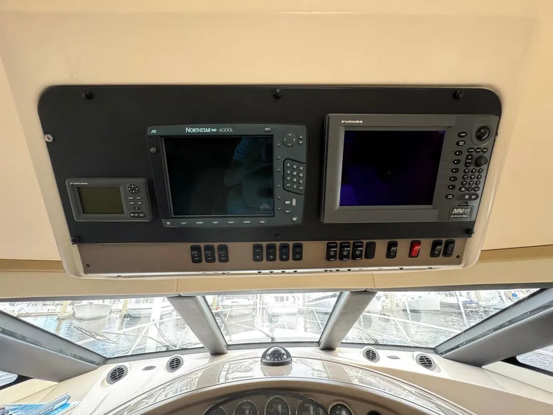Slide: The Image of Control panel of 2006 Carver 56 Voyager yacht with navigation screens and instruments. - 39