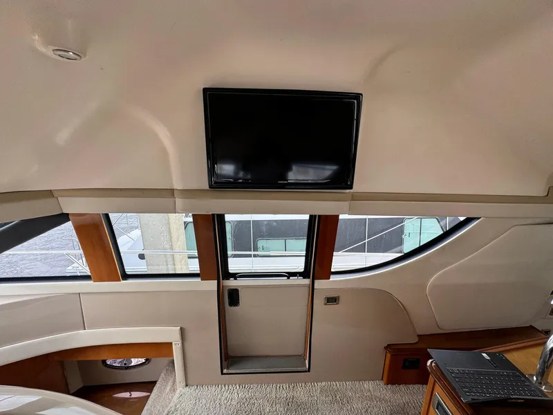 Slide: The Image of Interior of 2006 Carver 56 Voyager yacht with TV and modern furnishings. - 40