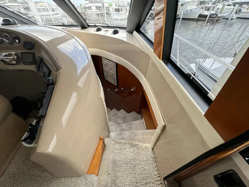 Slide: The Image of Interior view of 2006 Carver 56 Voyager yacht, featuring helm and staircase. - 41
