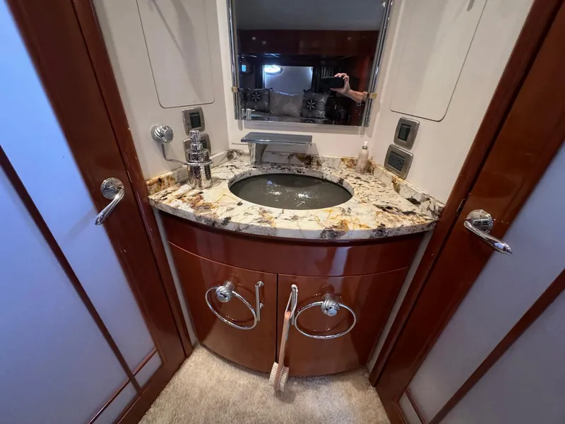 Slide: The Image of Luxurious bathroom vanity in 2006 Carver 56 Voyager yacht with marble countertop and modern fixtures. - 44