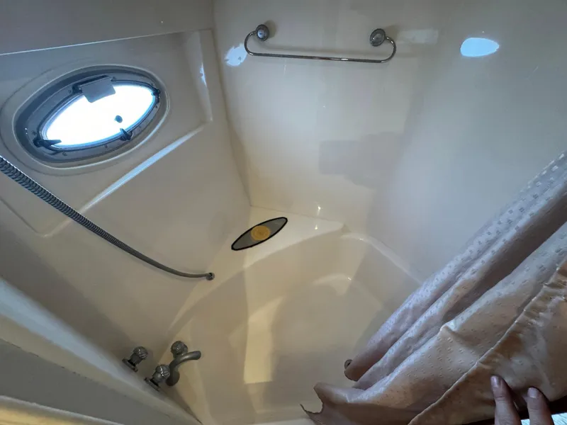 Slide: The Image of Bathroom interior of 2006 Carver 56 Voyager yacht with porthole and shower. - 46