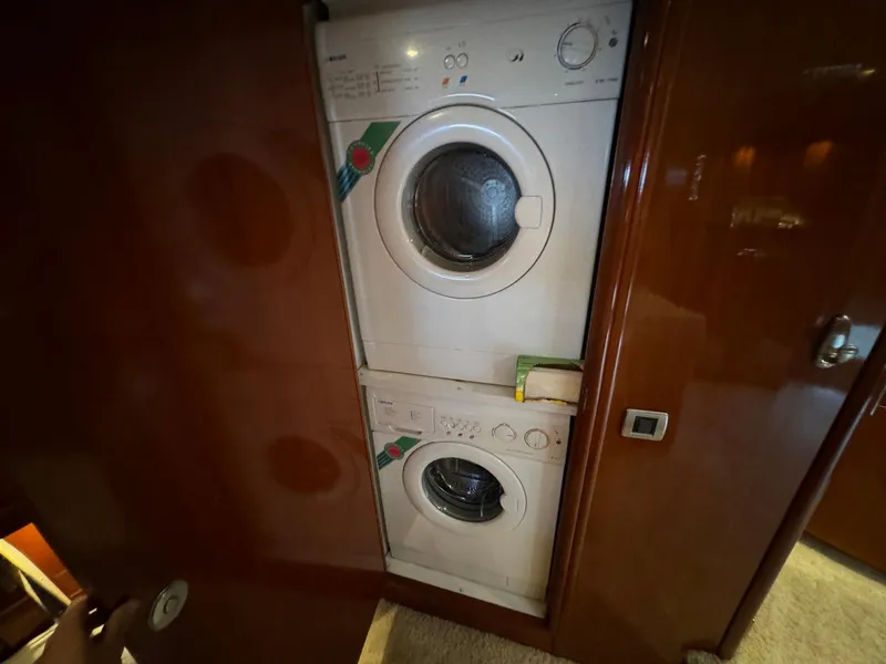 Slide: The Image of Stacked washer and dryer inside 2006 Carver 56 Voyager yacht. - 47
