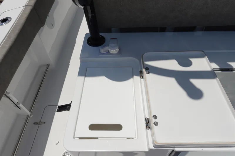 Slide: The Image of 2026 Sea Hunt Gamefish 30 boat interior with forward seating and storage compartments. - 16