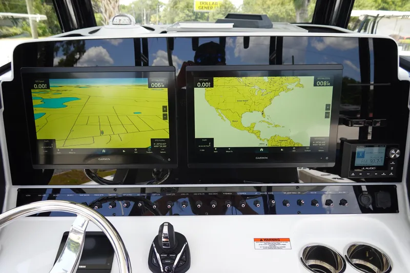 Slide: The Image of Dashboard of 2026 Sea Hunt Gamefish 30 with dual Garmin navigation screens. - 25