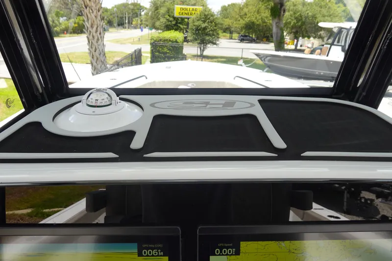 Slide: The Image of 2026 Sea Hunt Gamefish 30 dashboard with compass and navigation display. - 27