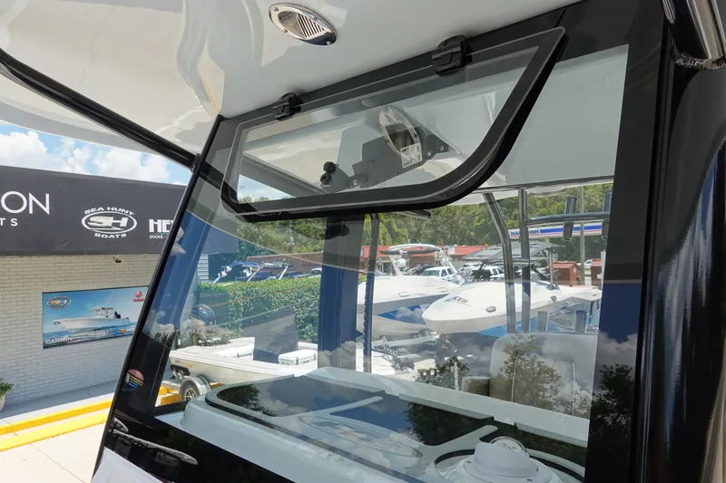 Slide: The Image of 2026 Sea Hunt Gamefish 30 Forward Seating boat window detail at dealership. - 30