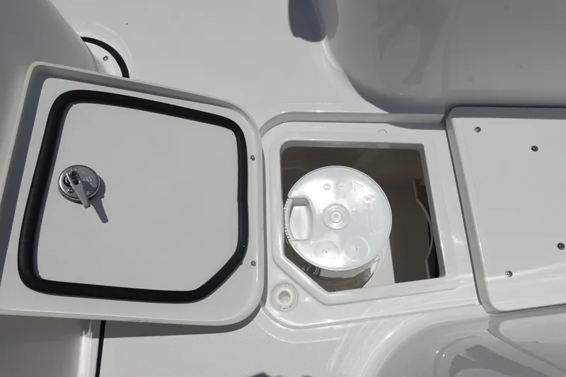 Slide: The Image of Open storage compartment on 2026 Sea Hunt Gamefish 30 boat, featuring forward seating. - 37