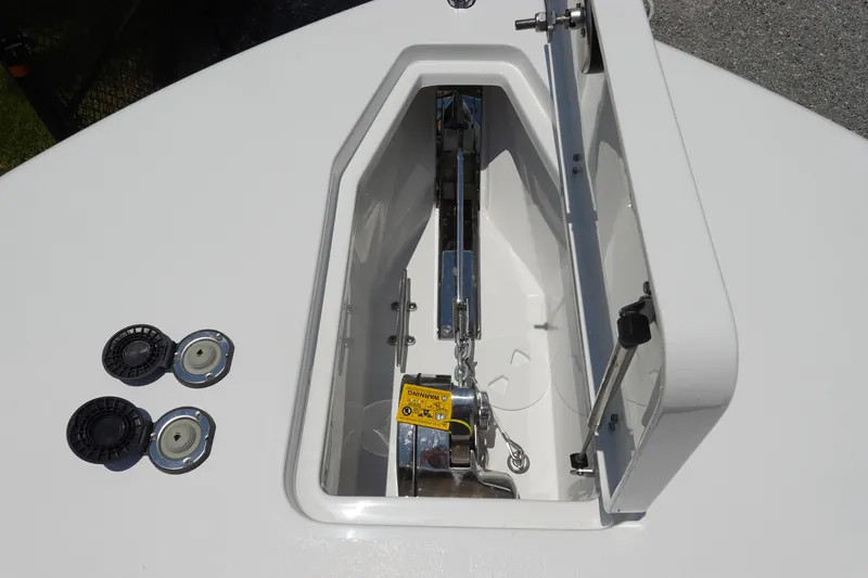 Slide: The Image of Anchor compartment of 2026 Sea Hunt Gamefish 30 Forward Seating boat, open with visible chain. - 40