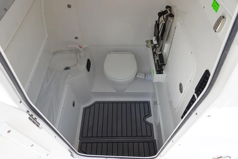Slide: The Image of 2026 Sea Hunt Gamefish 30 boat interior with toilet and storage area. - 42