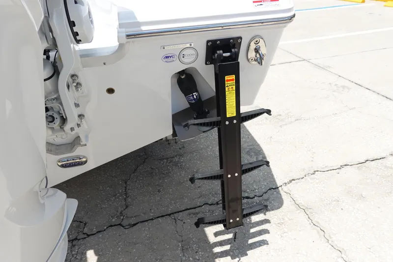 Slide: The Image of 2026 Sea Hunt Gamefish 30 boat with a mounted boarding ladder on the stern. - 9