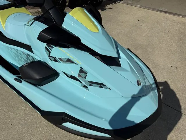 Slide: The Image of 2025 Yamaha Waverunner VX Limited HO in light blue with yellow accents, parked on concrete. - 11
