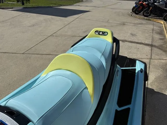 Slide: The Image of 2025 Yamaha Waverunner VX Limited HO with blue and yellow seating, parked outdoors. - 13