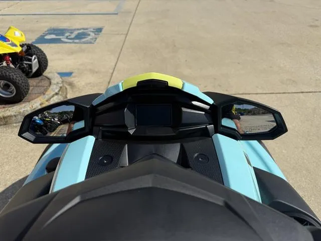Slide: The Image of 2025 Yamaha Waverunner VX Limited HO dashboard view with mirrors in a parking area. - 16