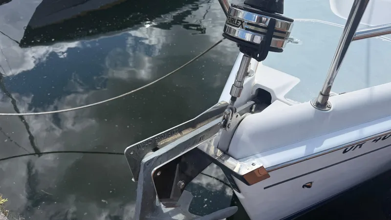 Slide: The Image of Bow of a 2002 Hunter 326 sailboat with anchor and water reflection. - 26