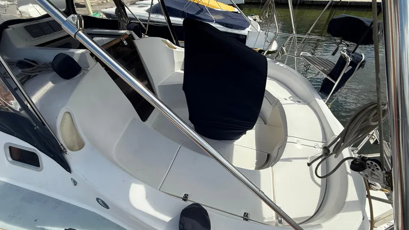 Slide: The Image of Cockpit of a 2002 Hunter 326 sailboat with seating and covered helm. - 30