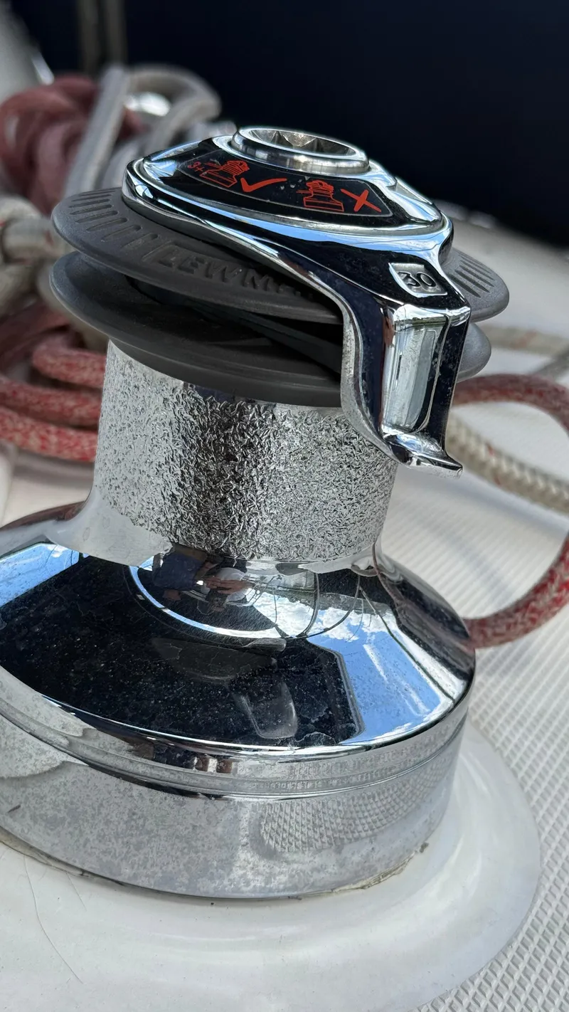Slide: The Image of Close-up of a shiny winch on a 2002 Hunter 326 sailboat deck. - 37