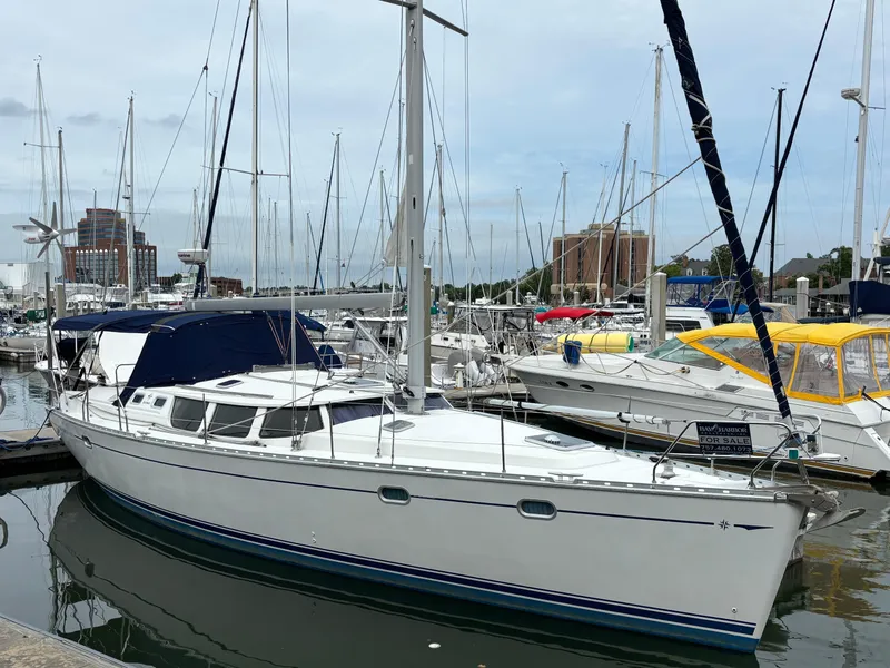 The Image of 2001 Jeanneau Sun Odyssey 43 DS sailboat docked in a marina. - 0