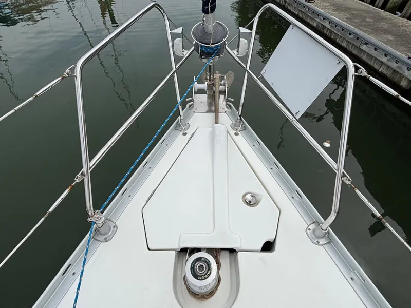 Slide: The Image of Bow of 2001 Jeanneau Sun Odyssey 43 DS sailboat with anchor and railing. - 11