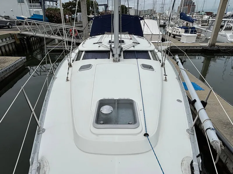 Slide: The Image of 2001 Jeanneau Sun Odyssey 43 DS sailboat docked at marina, top deck view. - 13