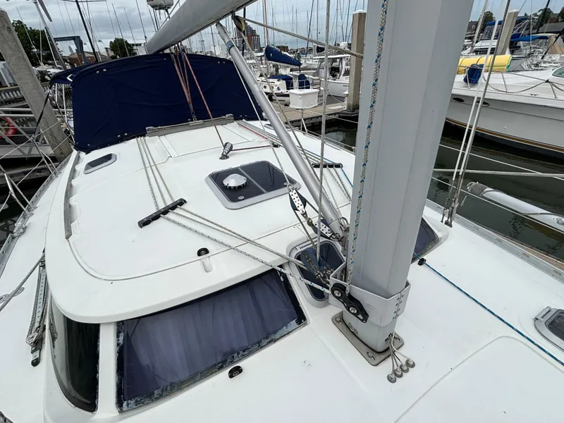 Slide: The Image of 2001 Jeanneau Sun Odyssey 43 DS sailboat docked at marina, showing deck and rigging. - 14