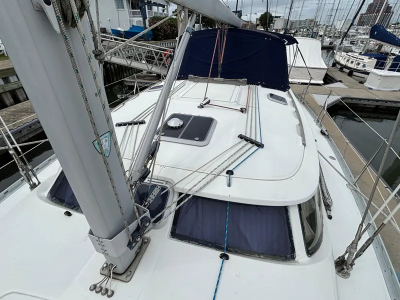 Slide: The Image of 2001 Jeanneau Sun Odyssey 43 DS sailboat docked at marina, view of deck and mast. - 15