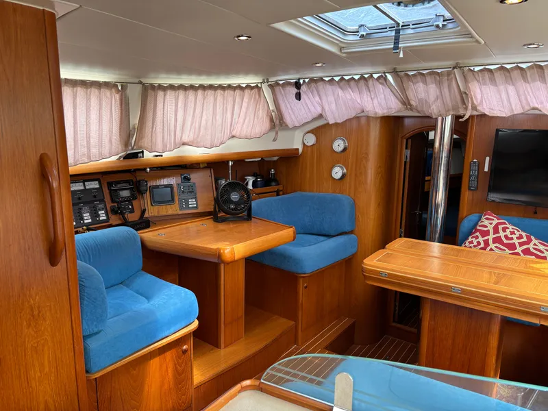Slide: The Image of Interior of 2001 Jeanneau Sun Odyssey 43 DS sailboat with blue seating and wooden finishes. - 23