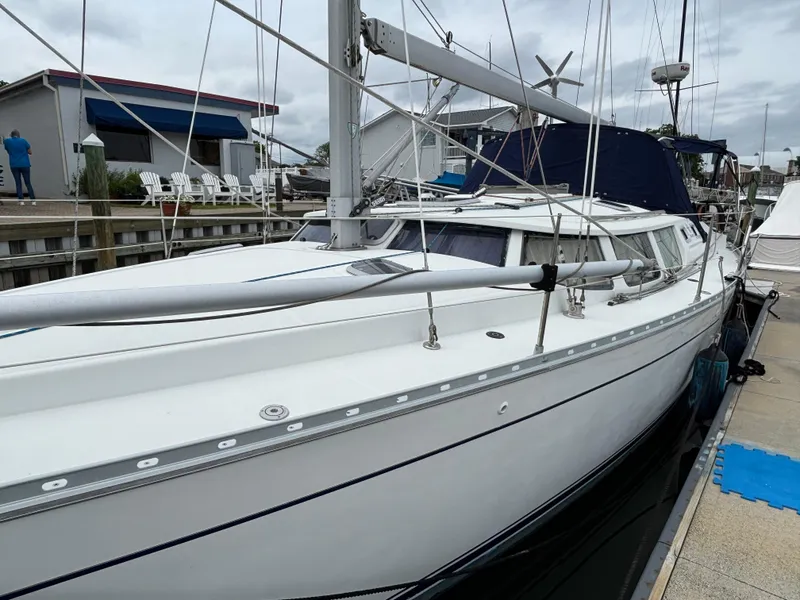 Slide: The Image of 2001 Jeanneau Sun Odyssey 43 DS sailboat docked at marina, side view. - 3